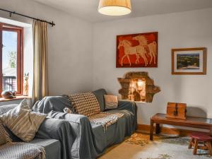 Et opholdsområde på Honeysuckle Cottage