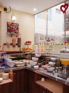 a buffet line with many food items on display at Gran Recreo Hotel - Trujillo - Perú in Trujillo