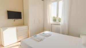 Ένα ή περισσότερα κρεβάτια σε δωμάτιο στο Villa Giulia - Italian Homing