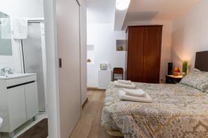 Ένα ή περισσότερα κρεβάτια σε δωμάτιο στο Casa Fernandes