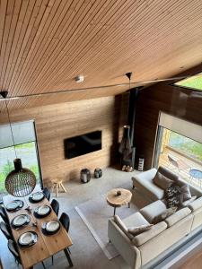 a living room with a couch and a table at Villa Primus in Ruka
