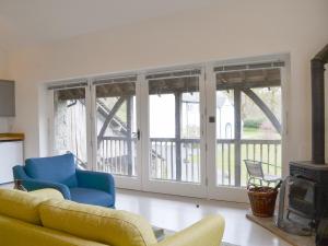 a living room with a couch and a fireplace at Staveley Park Studio - Uk33716 in Staveley
