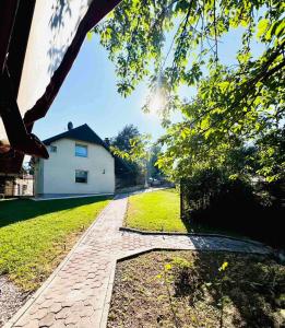 a brick walkway in front of a house at Villa RELAX Miševići in Sarajevo