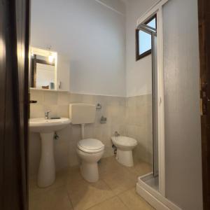 a bathroom with a toilet and a sink at Le Chiancate in San Giovanni Rotondo