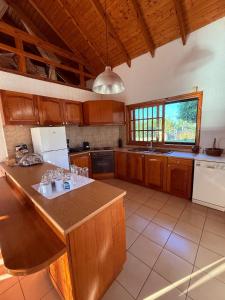 a kitchen with a island in the middle of it at Johnny Jo Villa in Aígio