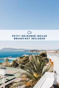 a view of the beach from the balcony of a beach house at Hôtel Les Voiles in Toulon