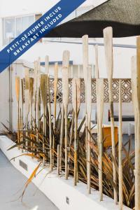 a group of wooden spoons on display in a museum at Hôtel Les Voiles in Toulon