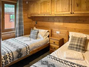 Postel nebo postele na pokoji v ubytování Lomond View Lodge