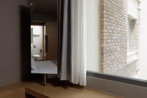 Koupelna v ubytování Elysion Hotel