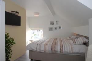Postel nebo postele na pokoji v ubytování B&B De Kaagse Boer