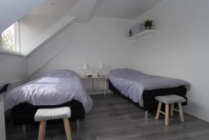 Postel nebo postele na pokoji v ubytování B&B De Kaagse Boer