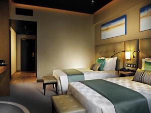 Tempat tidur dalam kamar di Resorts World Genting - Highlands Hotel