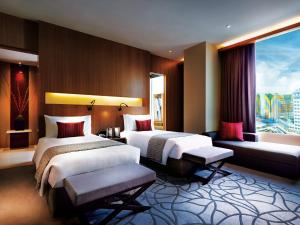 Giường trong phòng chung tại Resorts World Genting - Highlands Hotel