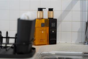 three bottles of essential oils sitting on a kitchen counter at Elegant Retreat Carnoustie in Angus +42 photos