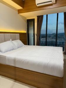 Katil atau katil-katil dalam bilik di Pollux Habibie Superior By Superstay