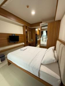 Katil atau katil-katil dalam bilik di Pollux Habibie Superior By Superstay