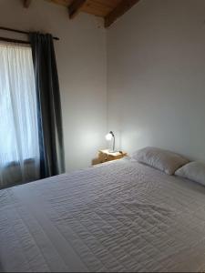 En eller flere senge i et værelse på Poncho ANDINO