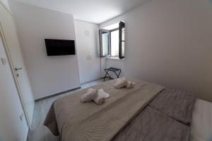 Postel nebo postele na pokoji v ubytování Apartman Zvane
