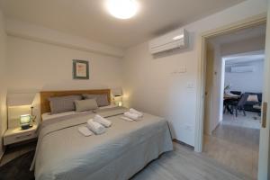 Postel nebo postele na pokoji v ubytování Apartman Zvane