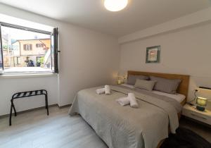 Postel nebo postele na pokoji v ubytování Apartman Zvane