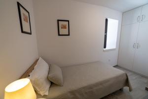 Postel nebo postele na pokoji v ubytování Apartman Zvane
