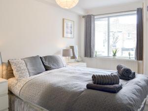 a bedroom with a bed with two towels on it at Harbour View - Uk44164 in Bridlington +4 photos
