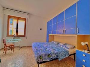 a bedroom with a bed and a table and a desk at Florentine Castle Apartment in Castelfiorentino