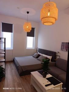 En eller flere senge i et værelse på GOA Beach Front Apartments