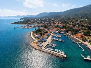 an aerial view of a harbor with boats in the water at Villa Karolina Großes Ferienhaus Meerblick 2000qm Garten Familien Gruppen Insel Lošinj in Nerezine