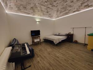 TV a/nebo společenská místnost v ubytování La casa del tempo
