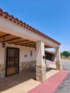 a front door of a building with a gate at Finca La Ecarada. Férez (Albacete) in Férez