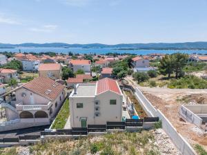 an aerial view of a house on a hill at Villa Franka - holiday home with a private pool in Sveti Filip i Jakov