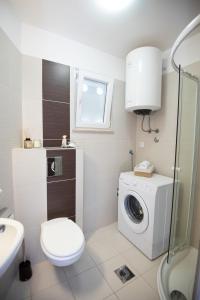 Phòng tắm tại Sunny apartment - by the sea +8 ảnh