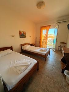 A bed or beds in a room at Hotel Giorgio