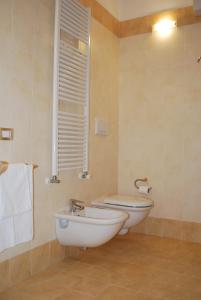a bathroom with a sink and a toilet in it at Lovely Apartment Verona in Verona
