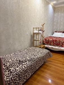 Voodi või voodid majutusasutuse Guest house Nano toas