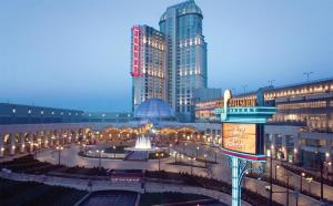 a city with tall buildings and a fountain in a courtyard at Hilton Niagara Falls/ Fallsview Hotel and Suites in Niagara Falls