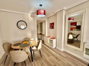 a dining room with a table and chairs in a room at Vacation Apartment in Els Poblets