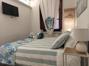 a bedroom with a bed and a television in it at Lerici Charme in Lerici