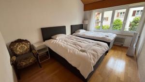 Postel nebo postele na pokoji v ubytování Garden Park Apartment