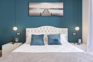 Postel nebo postele na pokoji v ubytování Daddi rooms & apartment