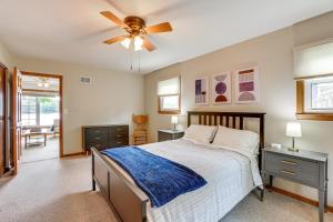a bedroom with a bed and a ceiling fan at Dock and Views Scenic Lakefront Escape in Harrison in Harrison