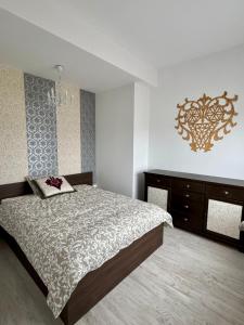 Ένα ή περισσότερα κρεβάτια σε δωμάτιο στο Tatra Horizon Apartmenty - 5 minut od Term Chochołowskich i Stoku Narciarskiego w Oravicach