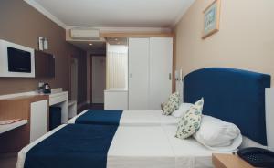Postel nebo postele na pokoji v ubytování L'ancora Beach Hotel