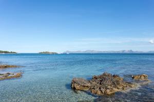 a view of the ocean with rocks in the water at Mar Hotels Alcanada in Port d'Alcudia
