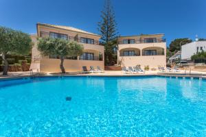 a large swimming pool in front of a building at Mar Hotels Alcanada in Port d'Alcudia
