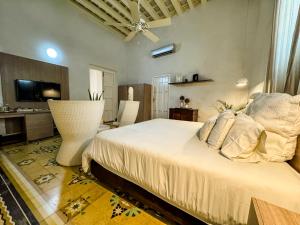 Postel nebo postele na pokoji v ubytování Hotel Boutique Don Pepe