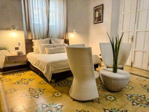Postel nebo postele na pokoji v ubytování Hotel Boutique Don Pepe