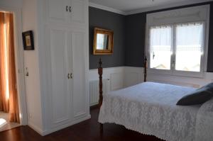 a bedroom with a bed and a window at Villa Jordana Urbapol One Step To The Beach in San Pol de Mar