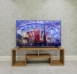 Televisyen dan/atau pusat hiburan di Wahaj Stylish Family Apartment
